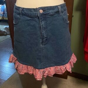 Size 1X (44in) denim skirt with pink ruffle at bottom. Great condition